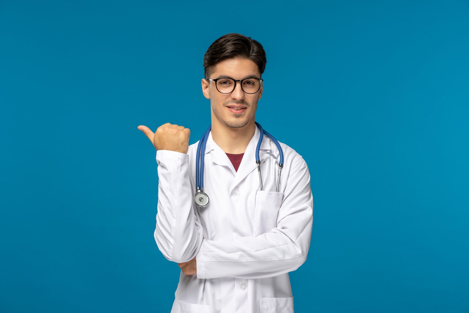 doctors-day-cute-young-brunette-guy-lab-coat-wearing-glasses-pointing-left