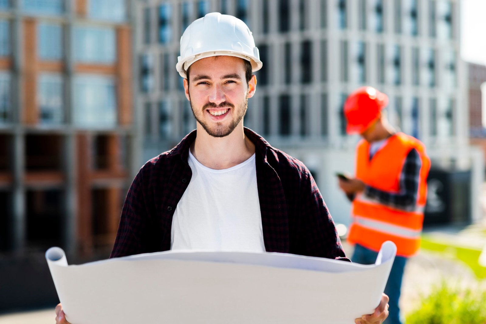 medium-shot-architect-holding-plans-looking-camera